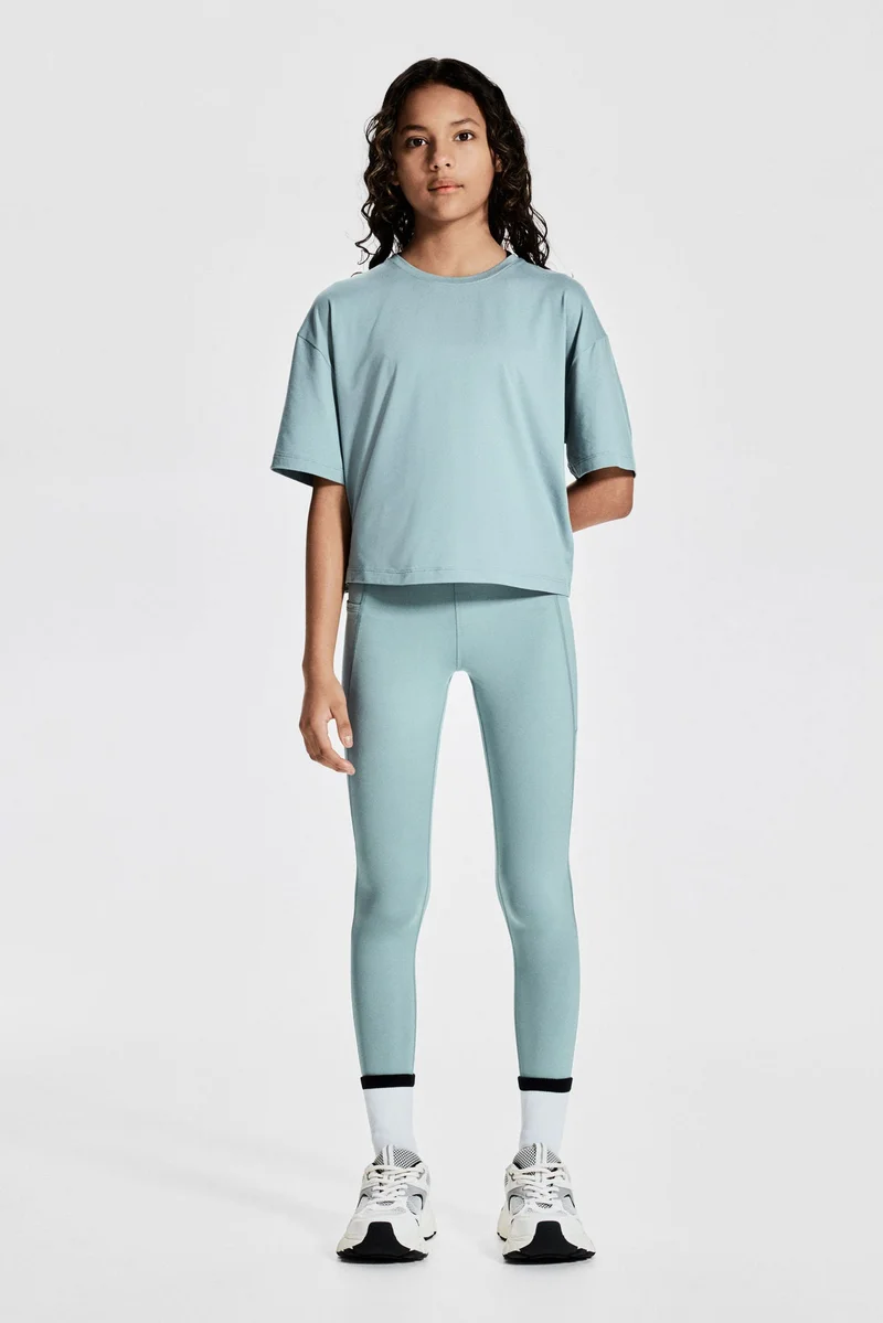 H&M Boxy-style sports top with DryMove™