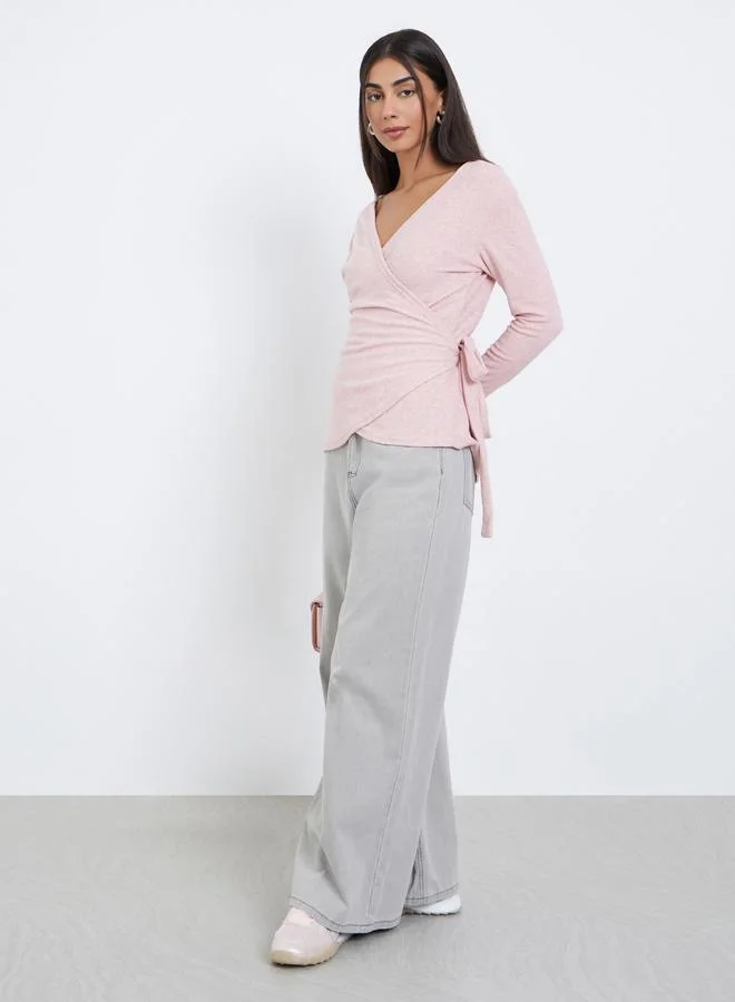 ستايلي بلوزة محبوكة سادة بأكمام طويلة وقصة ملتفة