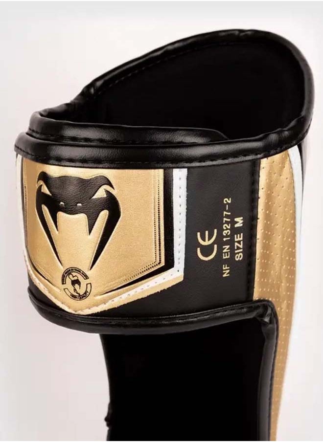 VENUM - واقيات الساق Elite Evo باللون الأبيض الذهبي - Image 1