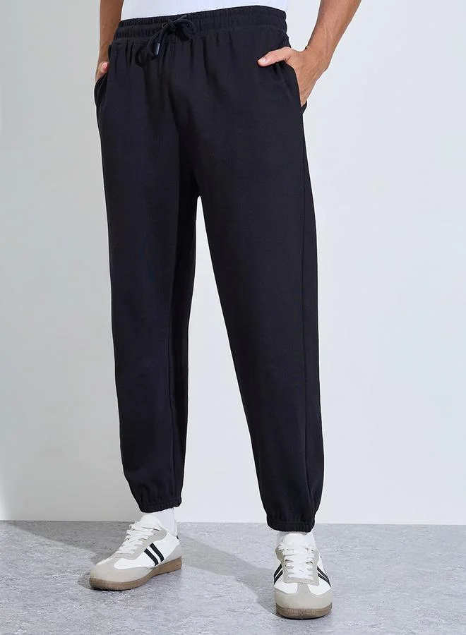 ستايلي Black Solid Elasticated Hem Relaxed Fit Joggers
