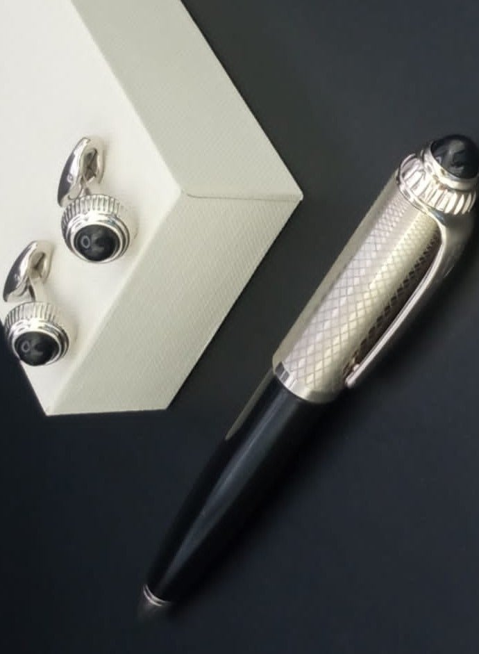 A luxurious and elegant pen and cufflink set with a box