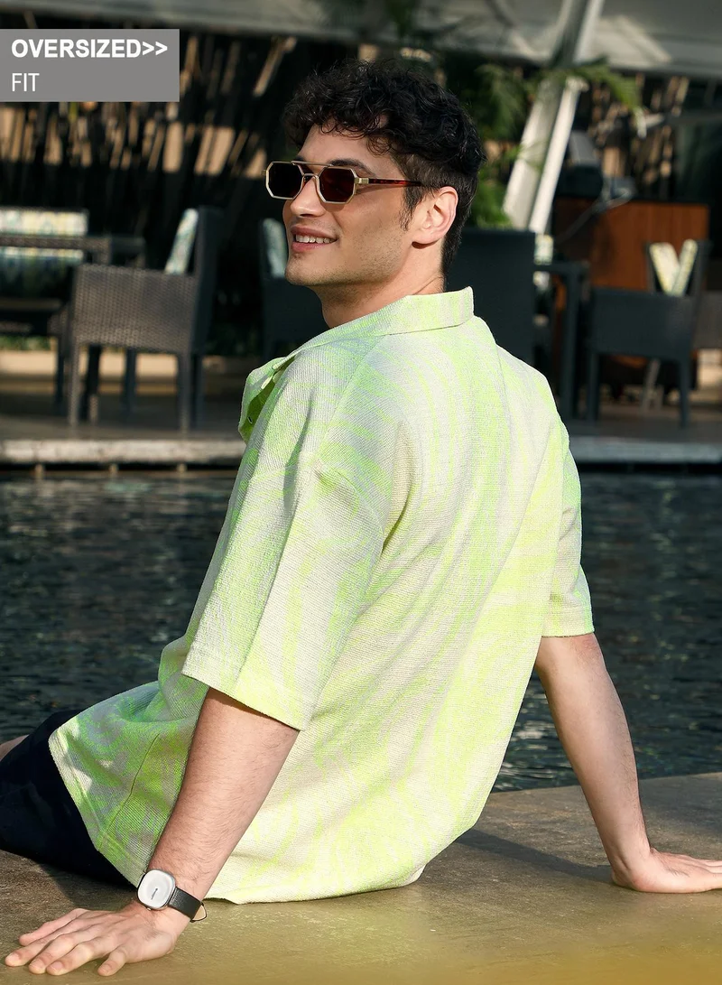 Campus Sutra Campus Sutra Men's Green & White Blaze Imprint Oversized Shirt For Casual Wear | Spread Collar | Short Regular Sleeves | Button Closure | Oversized Shirt Crafted With Comfort Fit For Everyday Wear