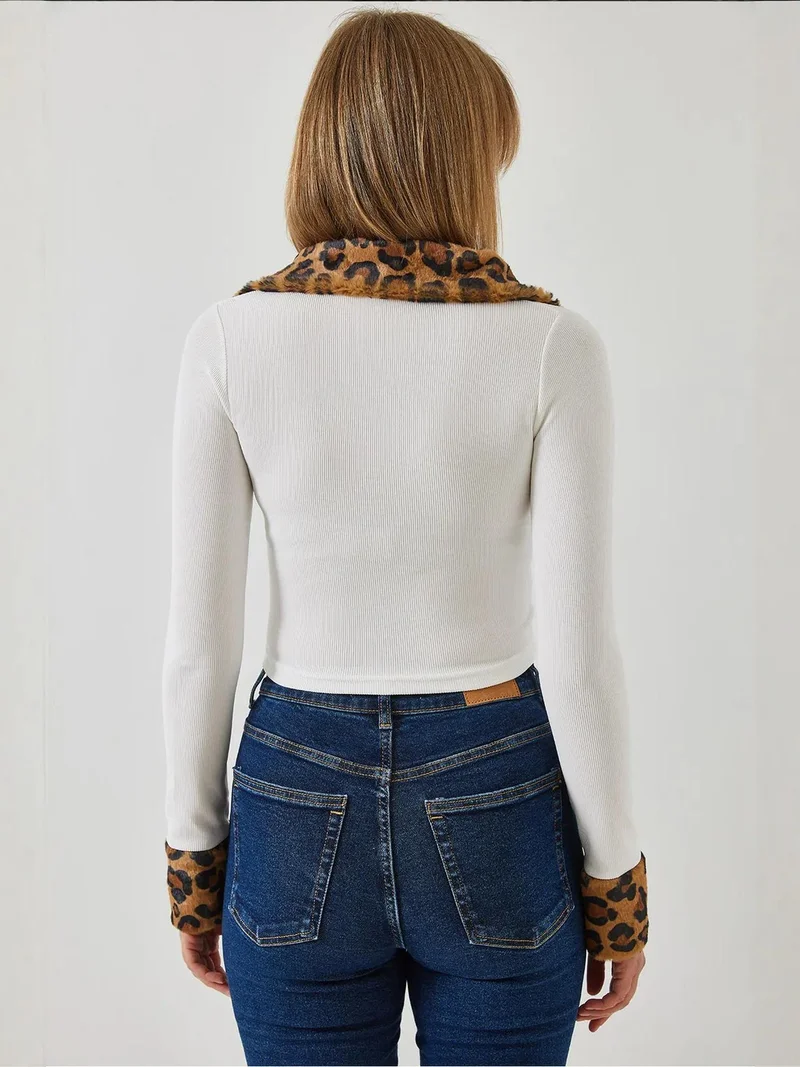 بيانكو لوتشي جاكيت قصير بغطاء رأس من فرو صناعي بطبعة جلد الفهد