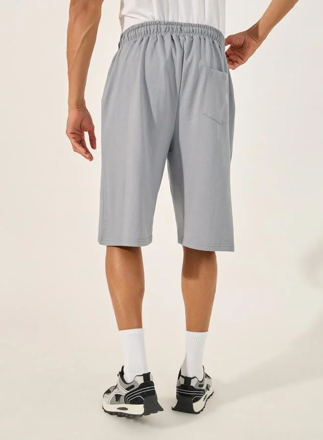 Styli Eco Earth Graphic Hem Printed Oversized Shorts
