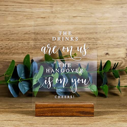 JINMURY Acrylic Wedding Open Bar Sign with Wood Stand- 5” x 7" Glass Look Clear Acrylic The Drinks Are On Us Sign with Holder for Wedding Reception & Event Party - Image 1