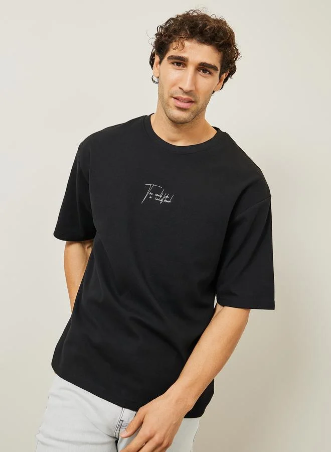 Styli Styli Oversized Embroidered Slogan Interlock T-Shirt