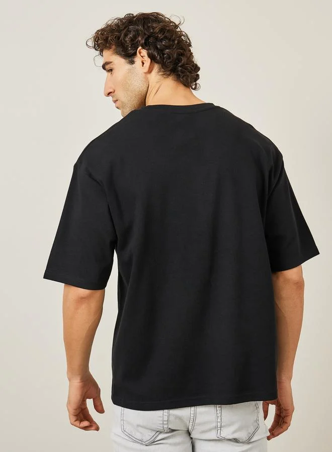 Styli Styli Oversized Embroidered Slogan Interlock T-Shirt