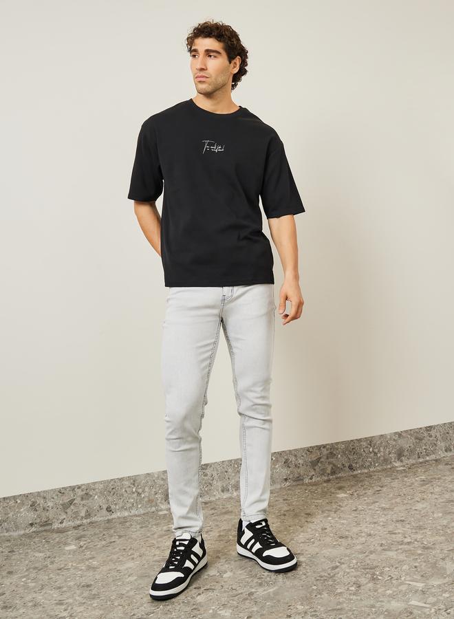 Styli Oversized Embroidered Slogan Interlock T-Shirt - Image 2