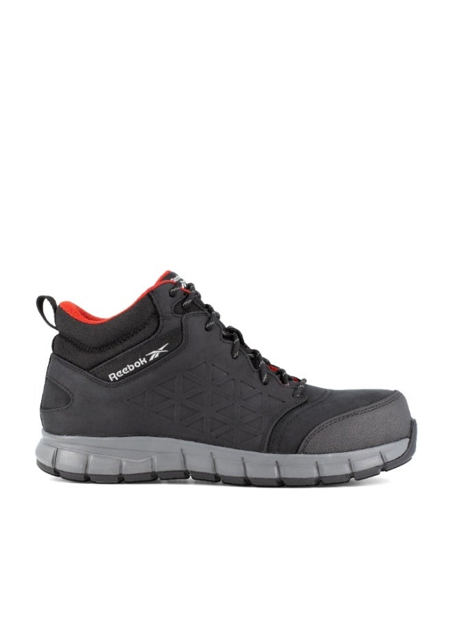 Reebok Work إكسل لايت | IB1037-1S3 – أسود، حذاء سلامة قصّة متوسطة بمقدمة ألومنيوم وجلد مقاوم للماء ونعل مقاوم للانزلاق SRC - Image 1