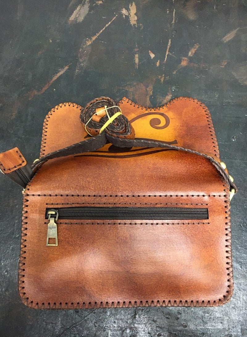 🎒 Handmade Genuine Leather Crossbody Bag – Small but Super Stylish 100% handcrafted genuine leather 3 zippered compartments for smart organization Magnetic clasp for easy and secure closure Includes built-in card slots Comes with handle + adjustable crossbody strap Size: 22×18 cm – perfect for daily use or casual outings 🛍️ Available now on Noon  From Real leather. Real craftsmanship. - Image 2