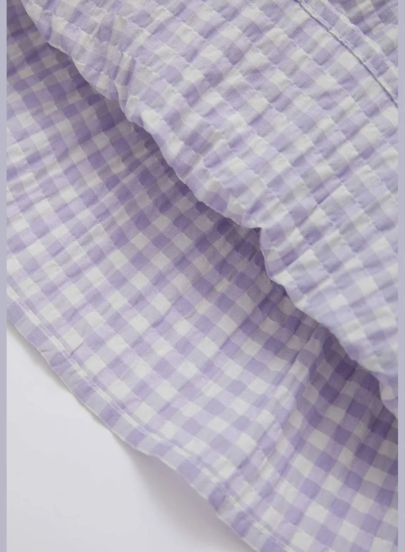 ديفاكتو Sleeveless Frill Detail Check Print Mini Dress