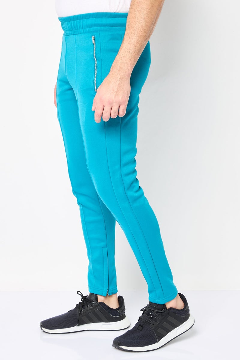 PUMA سروال رياضي للرجال مناسب للجري، أزرق فيروزي - Image 3