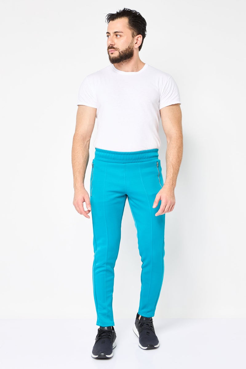 PUMA سروال رياضي للرجال مناسب للجري، أزرق فيروزي - Image 4