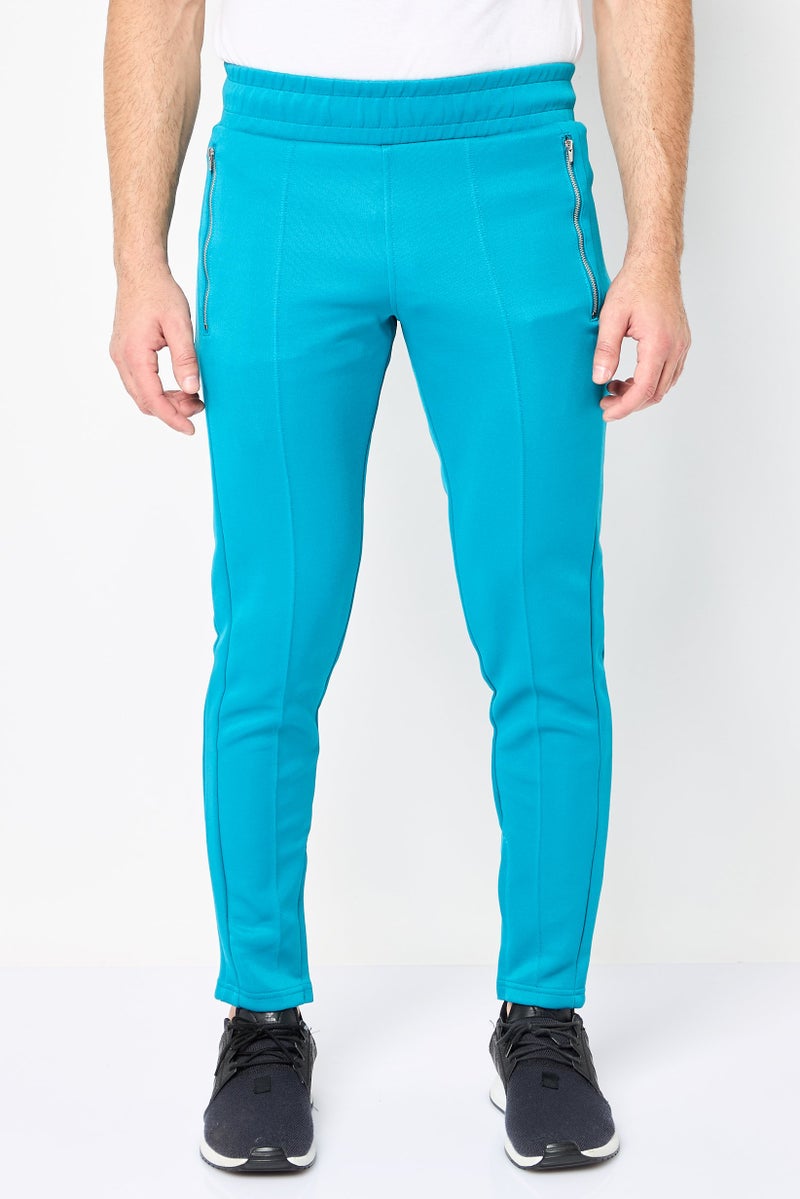 PUMA سروال رياضي للرجال مناسب للجري، أزرق فيروزي - Image 1