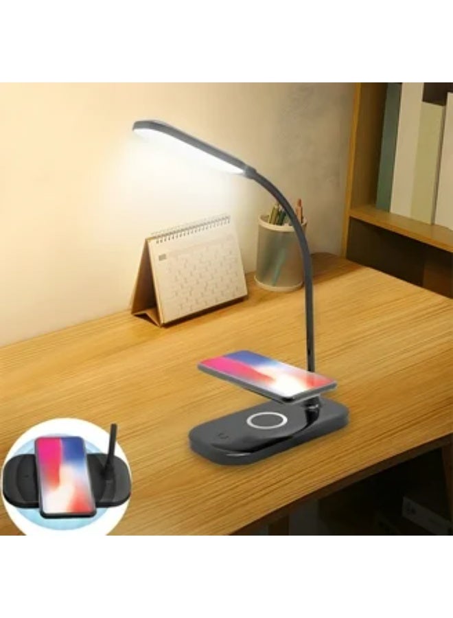 Modern LED Desk Lamp with Wireless Charging Pad This is a sleek, modern desk lamp featuring an adjustable LED light arm and an integrated wireless charging pad for smartphones. - Image 1