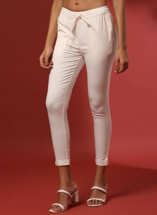 أبهشتي Fitted narrow stretch pants with slits- offwhite
