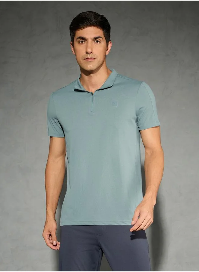 تكنوسبورت Technosport Solid 4-Way Stretch Half Zip Front Slim Fit Polo T-Shirt