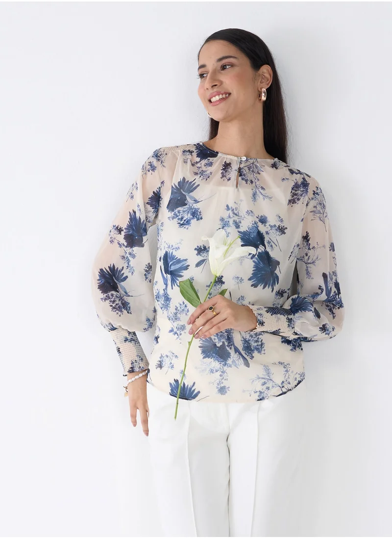 Salt Attire Women's Blue and White Floral Pattern Top with Classic Round Neckline, Keyhole Opening, and Stylish Full Length Smocked Sleeves Ideal for Spring and Summer Outfits