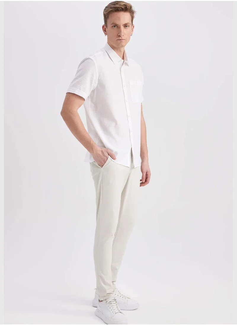 ديفاكتو Man Carrot Fit Chino Trousers