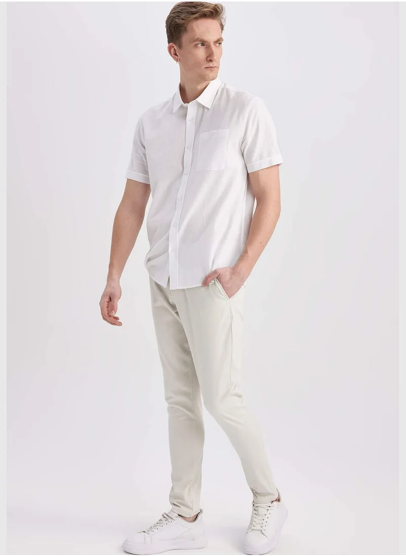 ديفاكتو Man Carrot Fit Chino Trousers