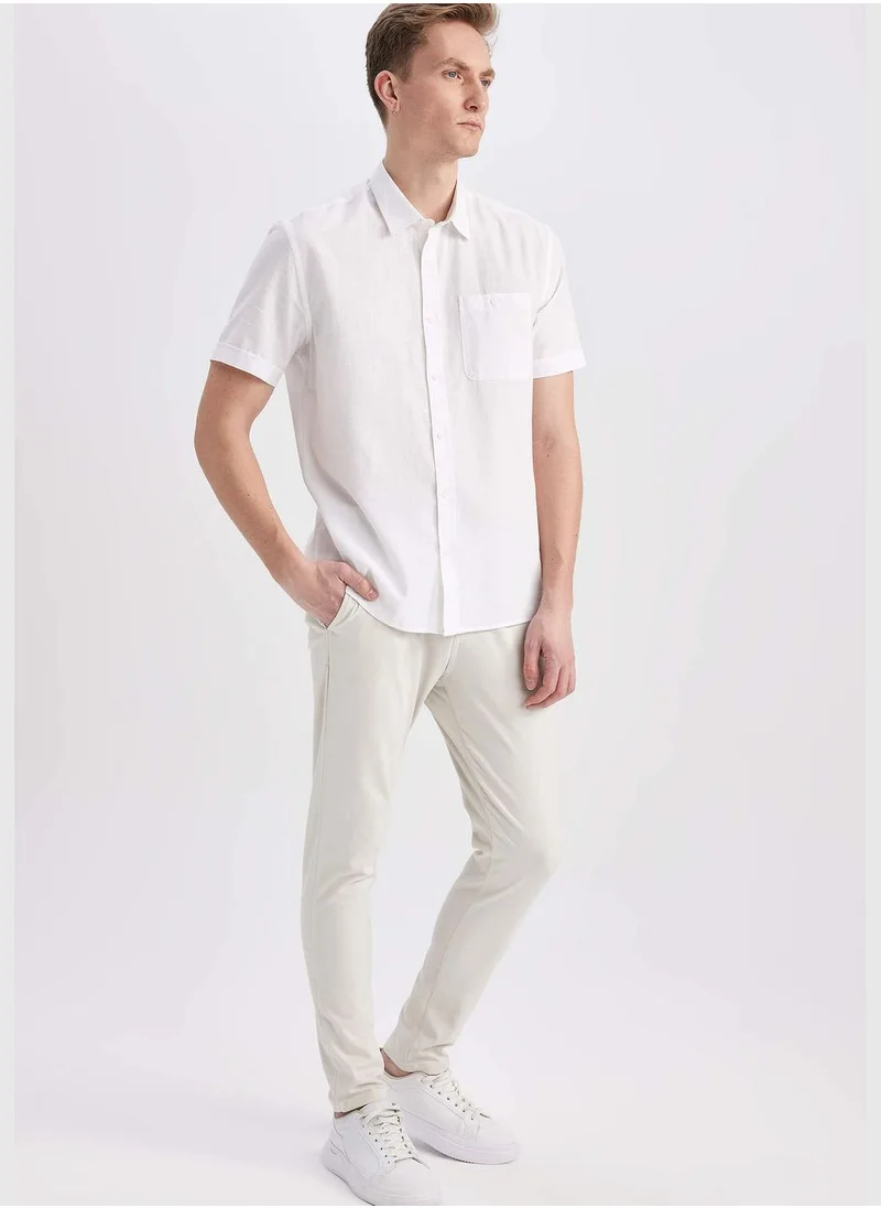 ديفاكتو Man Carrot Fit Chino Trousers