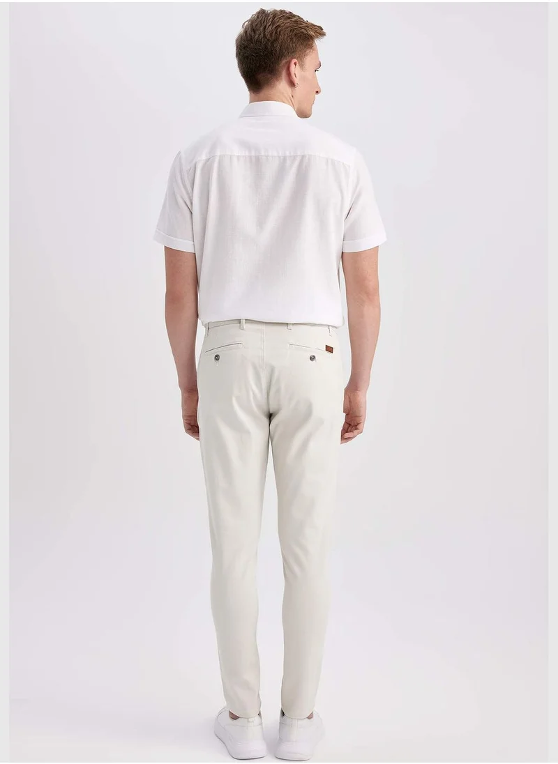 ديفاكتو Man Carrot Fit Chino Trousers