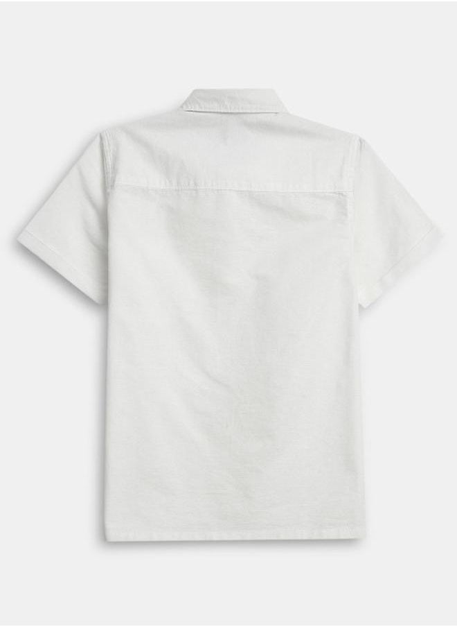 Bonkids - Boy's shirts in regular fit white colour cotton fabric embellished pattern pull over closure woven weave type round collar type round neckline half sleeve length button down upper body wear type suitable for casual occasions – where comfort meets vibrant creativity! - Image 1
