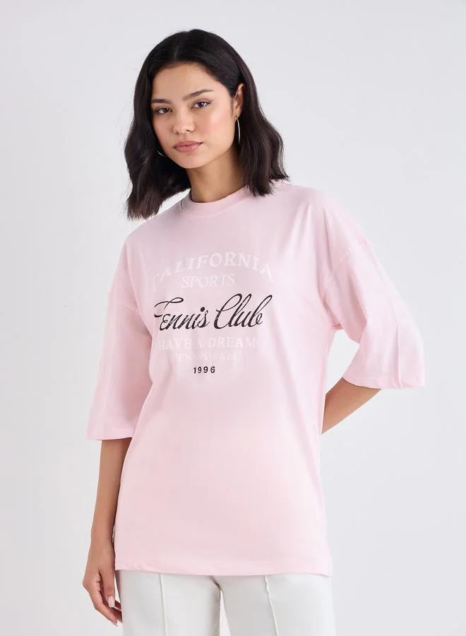 Styli Styli Women Pink Slogan Print Dropped Shoulder Oversized T-Shirt