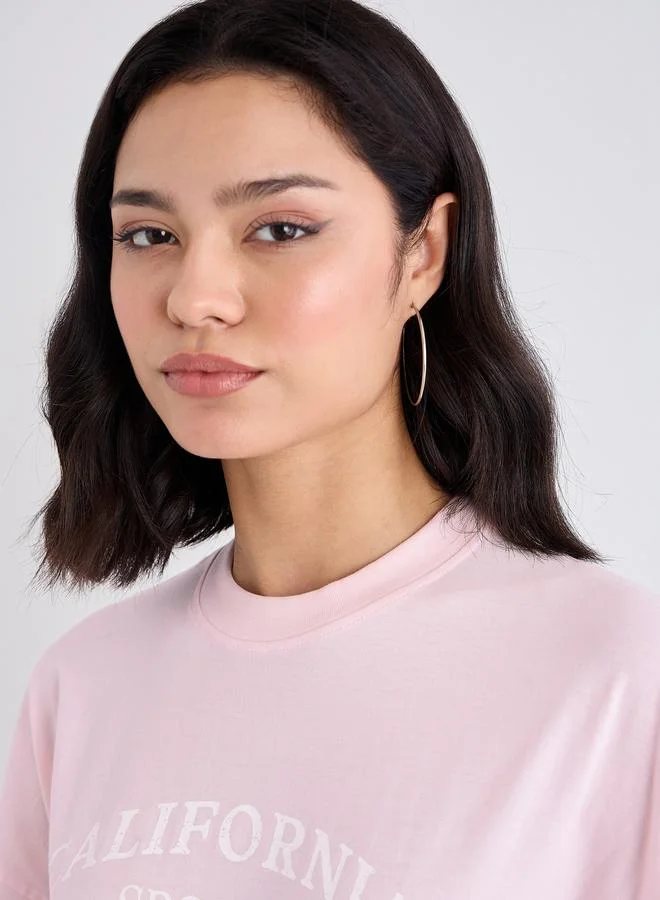 Styli Styli Women Pink Slogan Print Dropped Shoulder Oversized T-Shirt