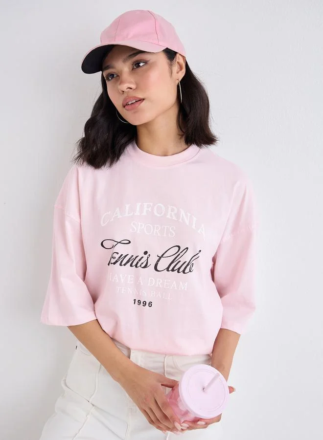 Styli Styli Women Pink Slogan Print Dropped Shoulder Oversized T-Shirt