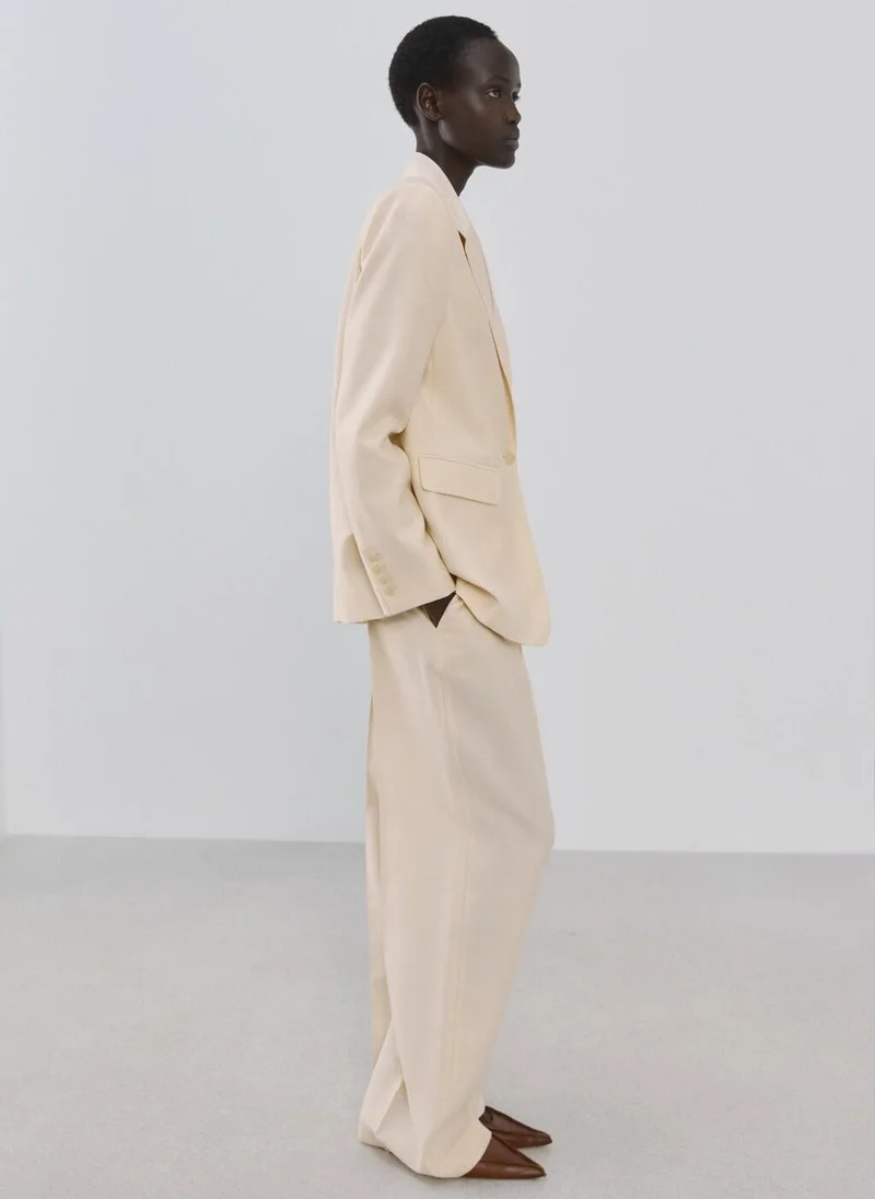 MANGO  Low-rise lyocell trousers for Women | Best Price UAE