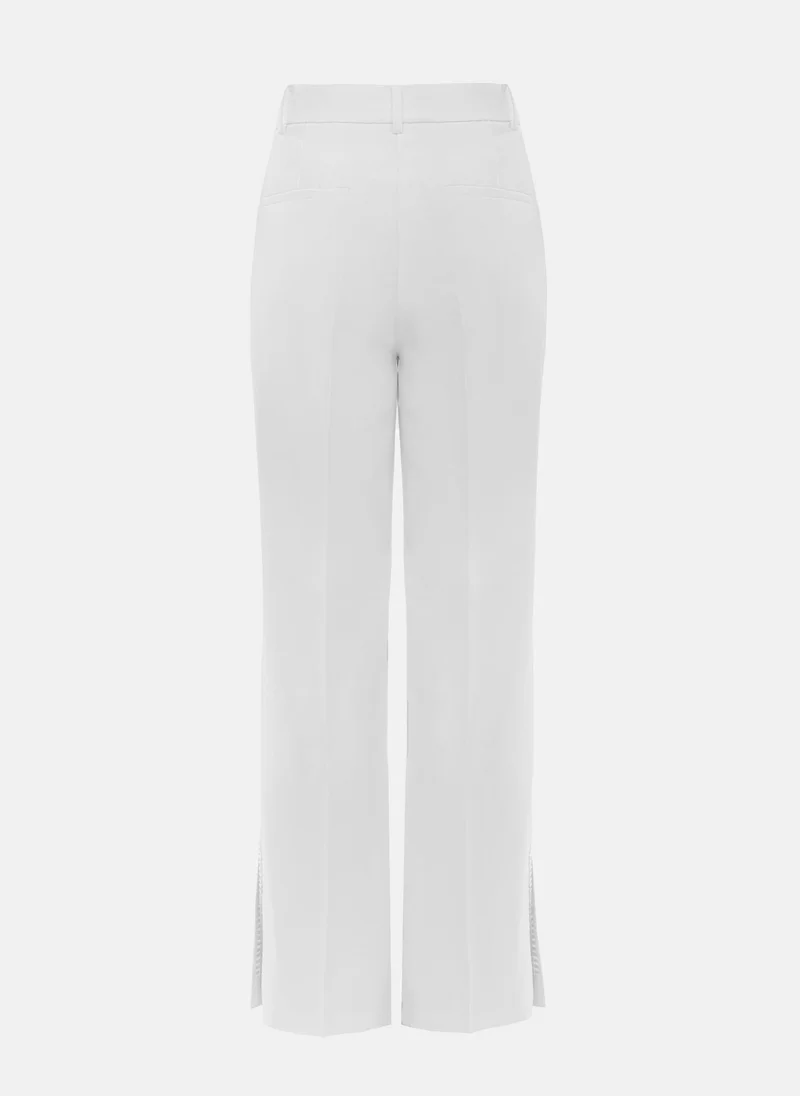 Lichi Trousers with slits on the pant legs and silvertone decor