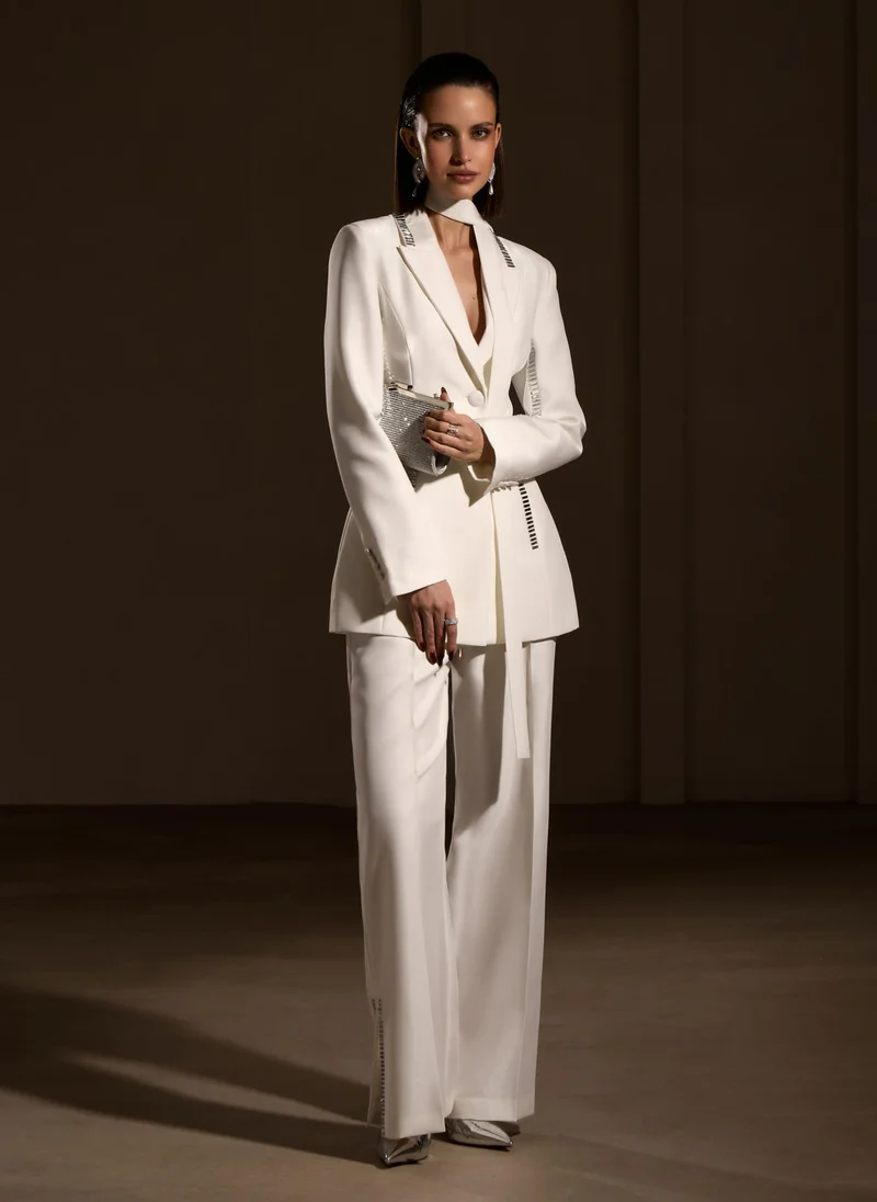 Lichi Trousers with slits on the pant legs and silvertone decor