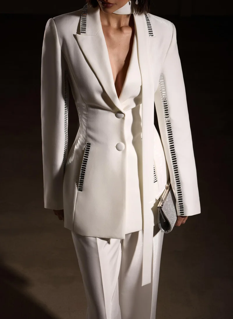 Lichi Trousers with slits on the pant legs and silvertone decor