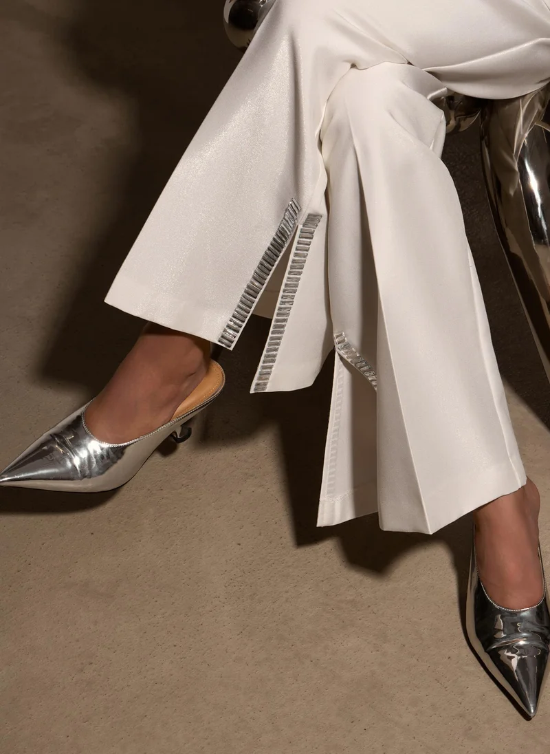 Lichi Trousers with slits on the pant legs and silvertone decor