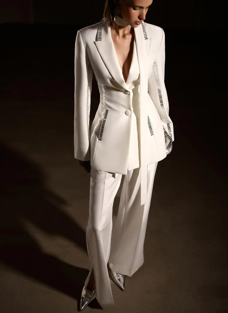 Lichi Trousers with slits on the pant legs and silvertone decor