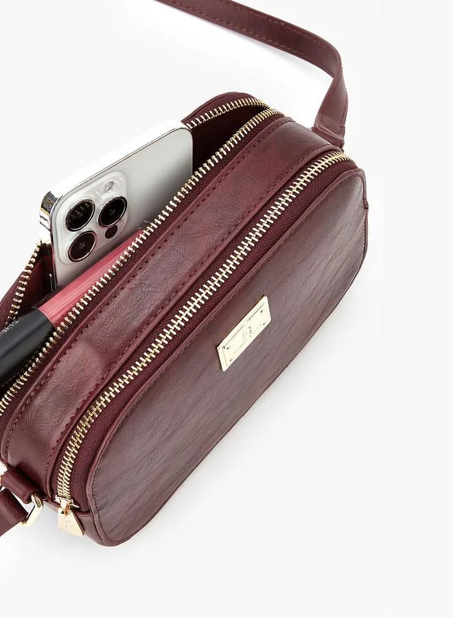 فلورا بيلا من شو إكسبرس حقيبة كروس بودي صلبة بحزام قابل للتعديل وإغلاق بسحاب