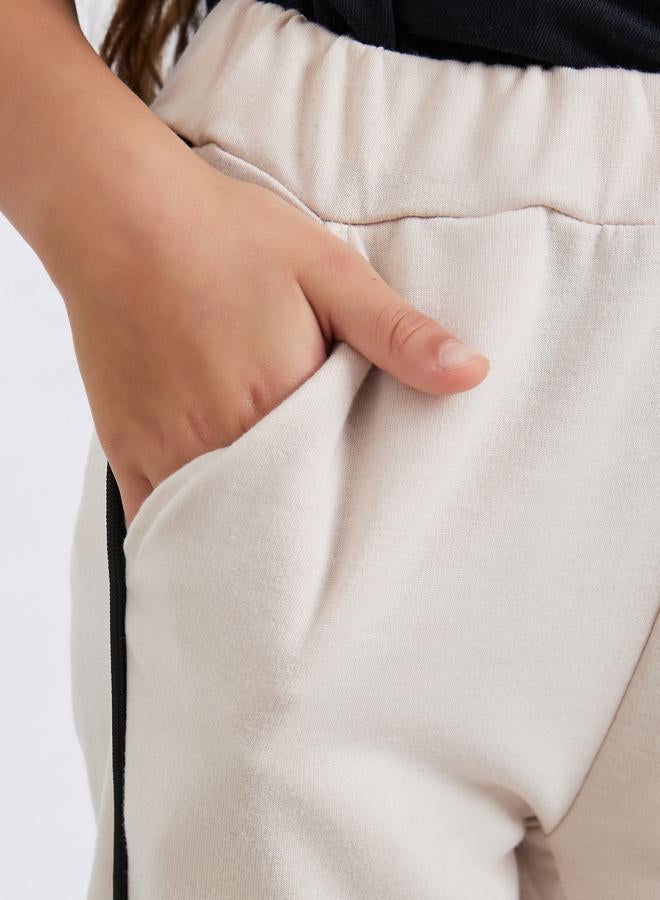 Styli Girls Beige Solid Joggers with Side Binding - Image 3