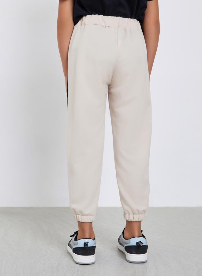 Styli Girls Beige Solid Joggers with Side Binding - Image 4