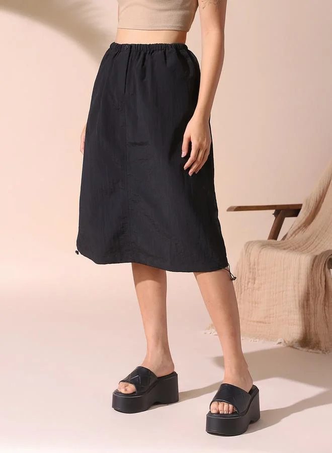 Dennis Lingo Women black regular fit solid nylon skirt with button closure- tailored to elevate your everyday.