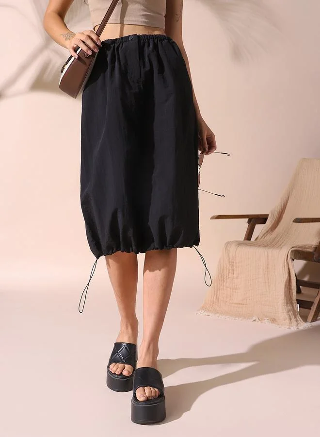 Dennis Lingo Women black regular fit solid nylon skirt with button closure- tailored to elevate your everyday.