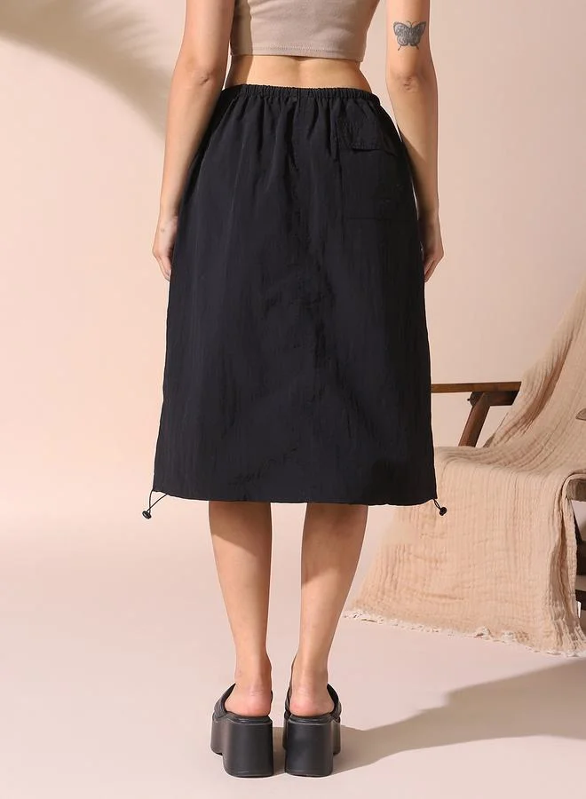 Dennis Lingo Women black regular fit solid nylon skirt with button closure- tailored to elevate your everyday.