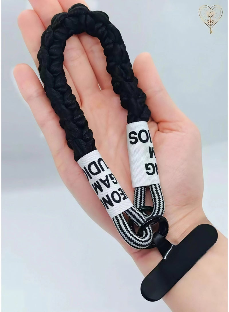 كيامور حبل معصم مضفراسود  للهاتف مزوّد بملصقات قماشية ومشابك من سبائك معدنية سوداء غير لامعة – سوار يد أنيق ومتين مصنوع من باراكورد قوي، يشمل لسان تثبيت من السيليكون القوي أو الجلد لتوصيل حامل البطاقة بأمان، مثالي للاستخدام اليومي، السفر، المناسبات، ومنع سقوط الهاتف - Image 4