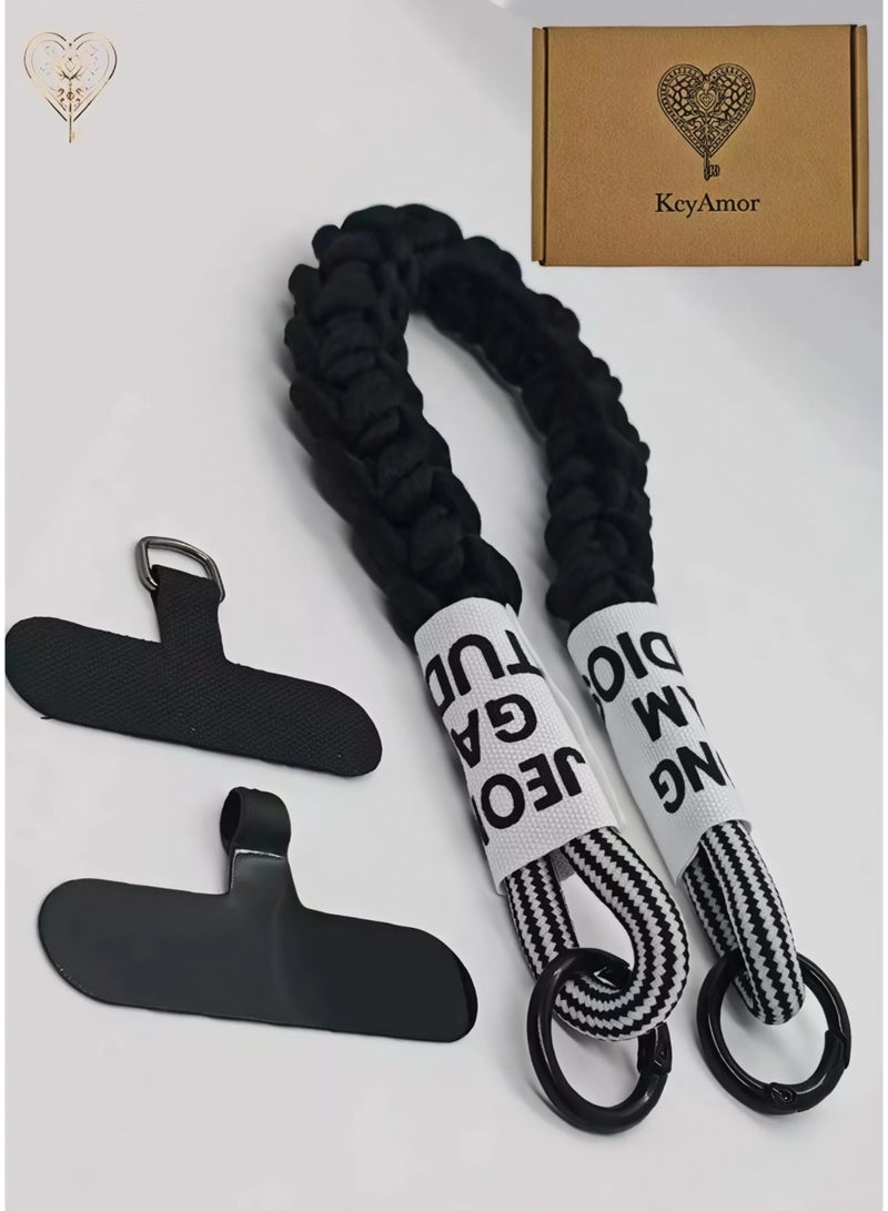 كيامور حبل معصم مضفراسود  للهاتف مزوّد بملصقات قماشية ومشابك من سبائك معدنية سوداء غير لامعة – سوار يد أنيق ومتين مصنوع من باراكورد قوي، يشمل لسان تثبيت من السيليكون القوي أو الجلد لتوصيل حامل البطاقة بأمان، مثالي للاستخدام اليومي، السفر، المناسبات، ومنع سقوط الهاتف - Image 1