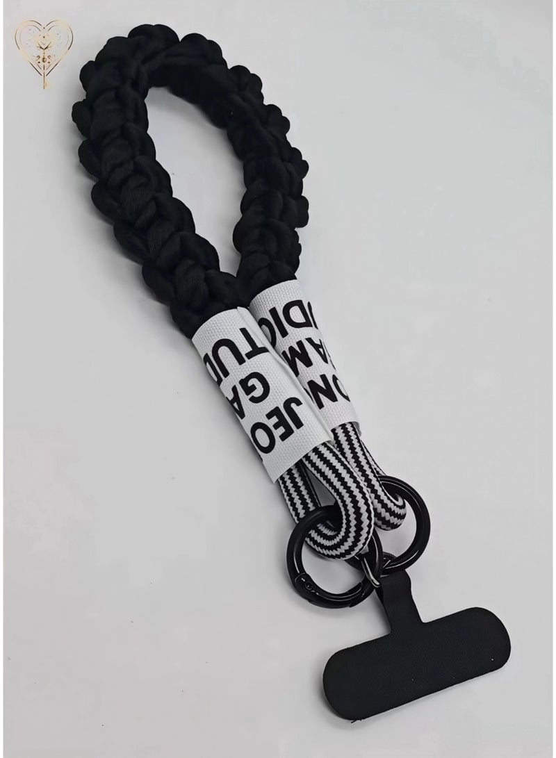 كيامور حبل معصم مضفراسود  للهاتف مزوّد بملصقات قماشية ومشابك من سبائك معدنية سوداء غير لامعة – سوار يد أنيق ومتين مصنوع من باراكورد قوي، يشمل لسان تثبيت من السيليكون القوي أو الجلد لتوصيل حامل البطاقة بأمان، مثالي للاستخدام اليومي، السفر، المناسبات، ومنع سقوط الهاتف - Image 5