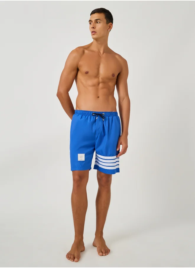 ستايلي Styli Striped Regular Fit Swim Shorts with Badge Detail