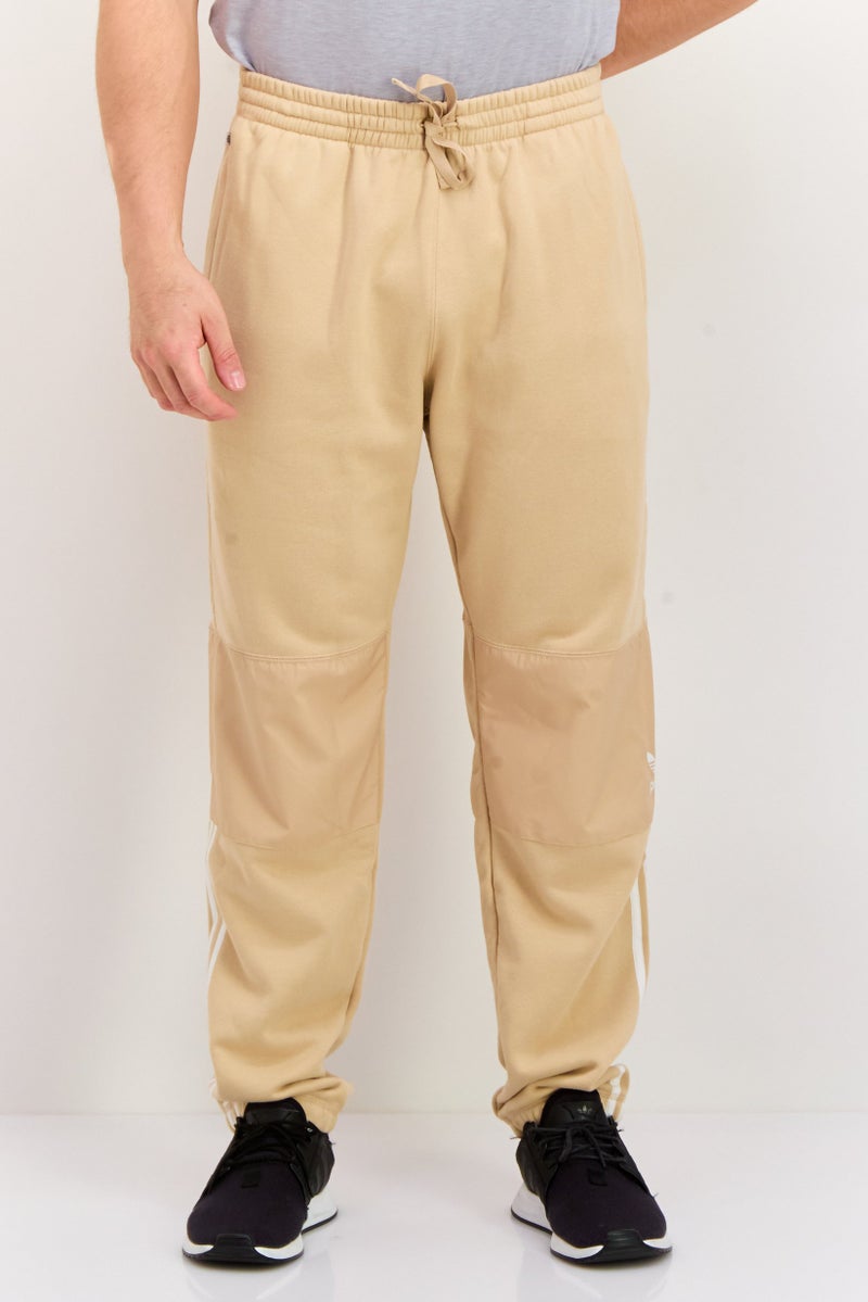 adidas Originals Men Sportswear Fit Outdoor Sweatpants, Tan  - Image 1