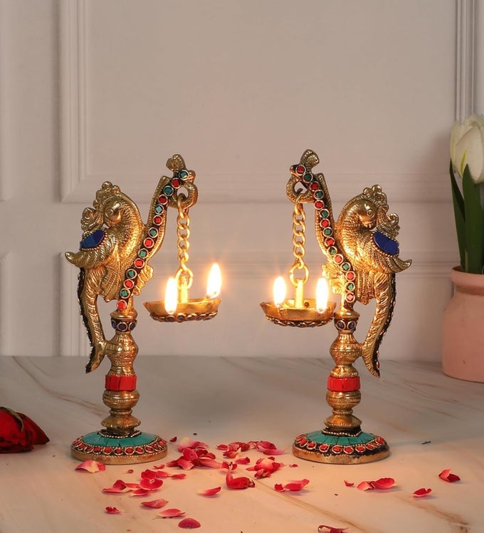 GEMSTONE WORK PEACOCK ON PILLAR DESIGN BRASS DIYA PAIR BRASS DIYAS FOR HOMETEMPLE DIYAS FOR HOME DECOR BRASS OIL LAMP GIFTS FOR HOUSEWARMING MULTICOLORED STANDARD PACK OF 2