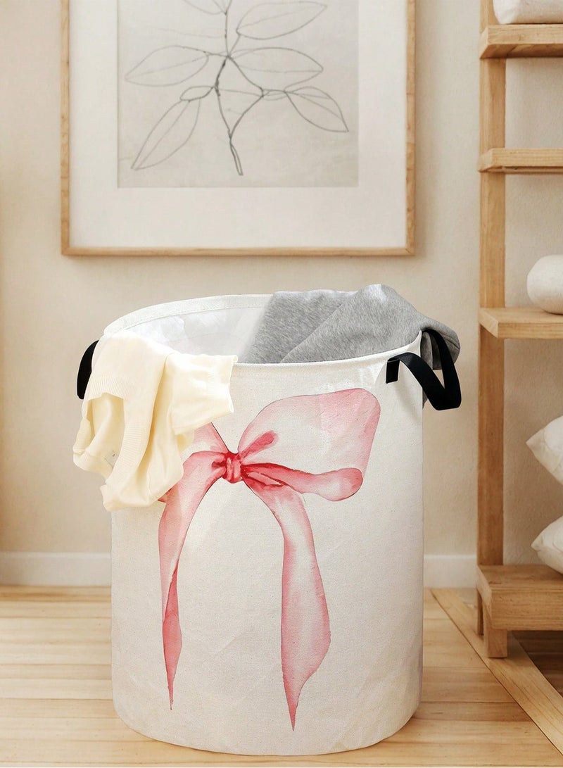 سلة غسيل ملابس قماشية باللون الأبيض مزينة بفيونكة وردية كبيرة سعة تخزين عملية مقاس 48×38 سم مع مقابض للحمل مناسبة لغرفة النوم والغسيل - Image 1