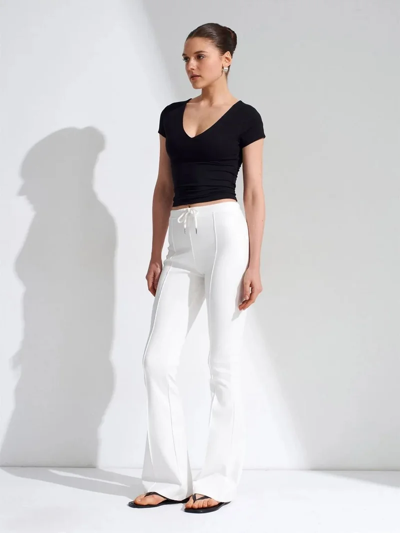 ديلفين DILVIN Mid-Waist Flare Jersey Pants With Drawstring